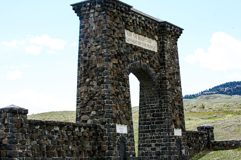 the large stone entrance to Yellowstone in Gardner, Montana