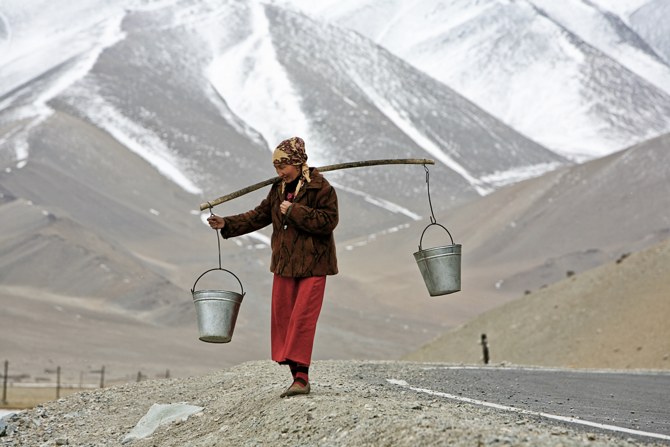 Uigher Woman Carrying Water